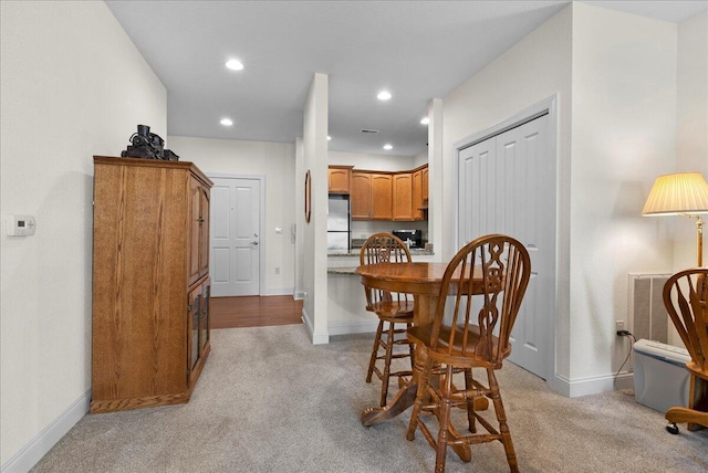 832 N 6th St Unit 118, Sheboygan, WI 53081 - dining area featuring light colored carpet, baseboards, and recessed lighting