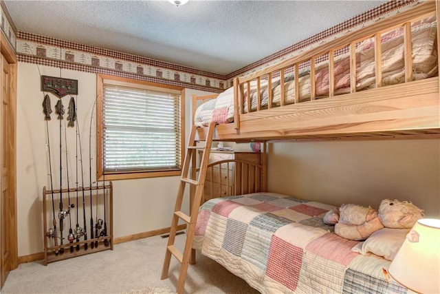 8360 W Shore Ln, Hayward, WI 54843 - bedroom with carpet, a textured ceiling, and baseboards