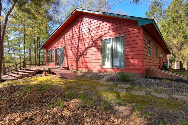 8360 W Shore Ln, Hayward, WI 54843 - view of side of home with a wooden deck