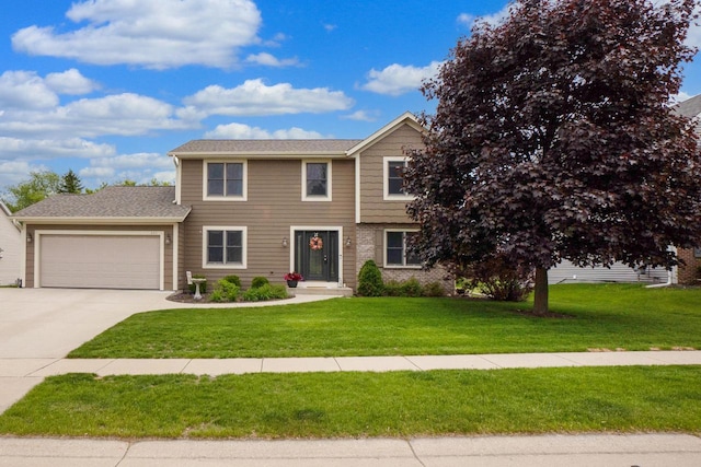 371 Thurow Dr, Oconomowoc, WI 53066 - view of front of property featuring an attached garage, a front lawn, and concrete driveway