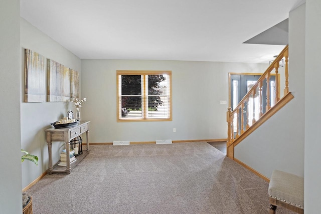 371 Thurow Dr, Oconomowoc, WI 53066 - empty room featuring stairway, carpet floors, and baseboards