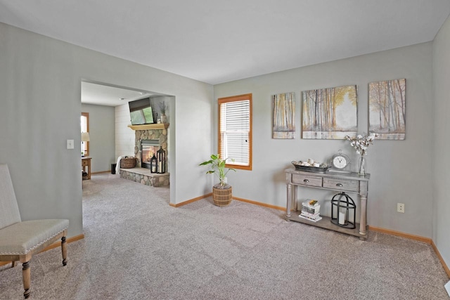 371 Thurow Dr, Oconomowoc, WI 53066 - sitting room with carpet flooring, baseboards, and a stone fireplace