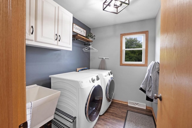 371 Thurow Dr, Oconomowoc, WI 53066 - washroom featuring cabinet space, independent washer and dryer, dark wood-style floors, and baseboards