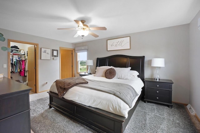 371 Thurow Dr, Oconomowoc, WI 53066 - bedroom featuring carpet flooring, a spacious closet, baseboards, and a ceiling fan