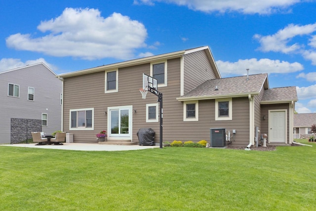 371 Thurow Dr, Oconomowoc, WI 53066 - back of property with cooling unit, a yard, a patio area, and roof with shingles