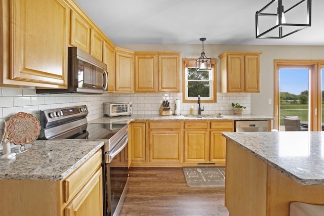 371 Thurow Dr, Oconomowoc, WI 53066 - kitchen with stainless steel appliances, a sink, healthy amount of natural light, and light brown cabinetry
