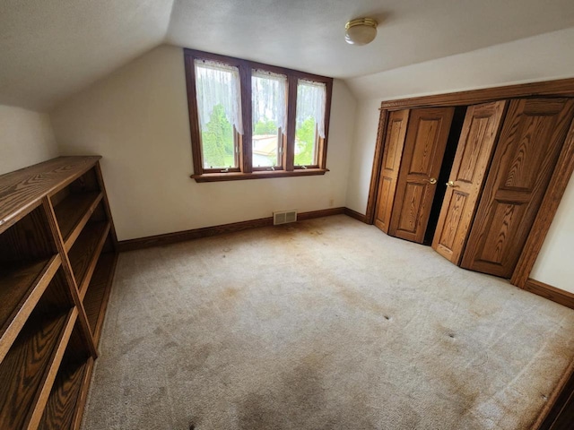 409 W Spence St, Colby, WI 54421 - bonus room with vaulted ceiling, light colored carpet, and baseboards