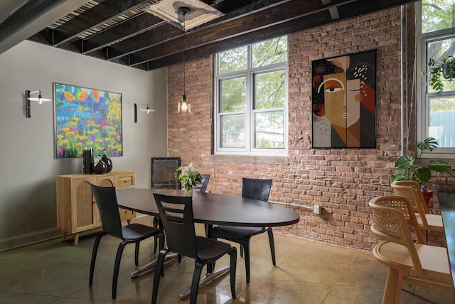 3059 N Weil St Unit 124, Milwaukee, WI 53212 - tiled dining space with brick wall and beamed ceiling