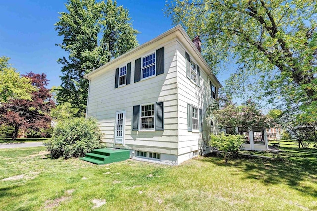 108 Healy Ct, Shawano, WI 54166 - view of side of property with a chimney and a yard