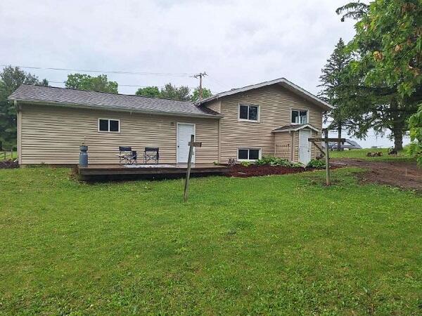 810 Railroad Ave, Viroqua, WI 54665 - rear view of property with a deck and a yard