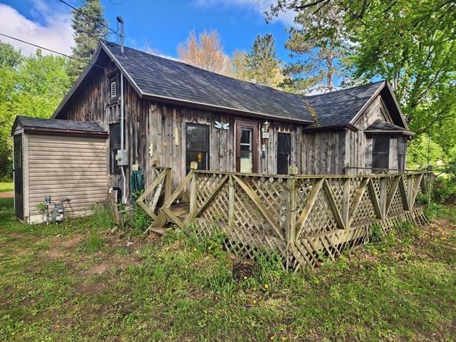 5183 2nd Ave, Pittsville, WI 54466 - view of front of house with a deck and a shingled roof