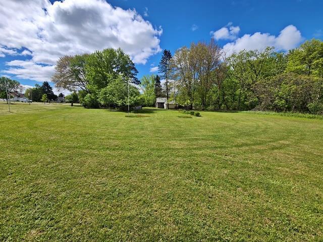 5183 2nd Ave, Pittsville, WI 54466 - view of green lawn featuring an outbuilding