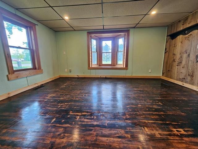 5183 2nd Ave, Pittsville, WI 54466 - spare room with hardwood / wood-style flooring, a drop ceiling, and baseboards