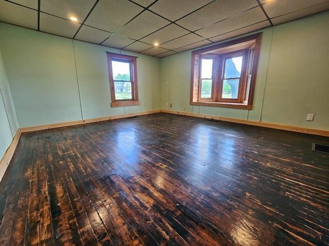 5183 2nd Ave, Pittsville, WI 54466 - spare room featuring hardwood / wood-style floors, a drop ceiling, and baseboards