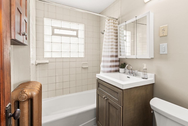 4648 S Kansas Ave Unit 4650, Saint Francis, WI 53235 - full bathroom featuring toilet, vanity, radiator heating unit, and shower / bath combo