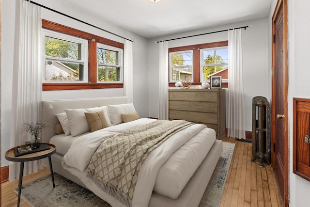 4648 S Kansas Ave Unit 4650, Saint Francis, WI 53235 - bedroom featuring light wood-style flooring and baseboards