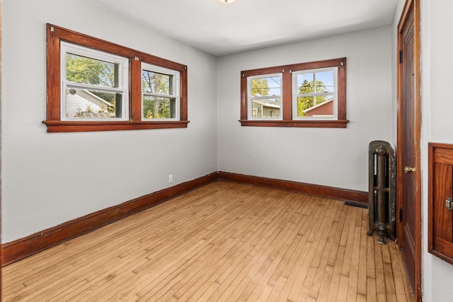 4648 S Kansas Ave Unit 4650, Saint Francis, WI 53235 - spare room featuring plenty of natural light, baseboards, and light wood finished floors