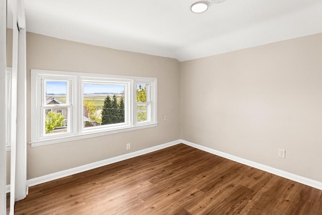 4648 S Kansas Ave Unit 4650, Saint Francis, WI 53235 - unfurnished room featuring baseboards and wood finished floors