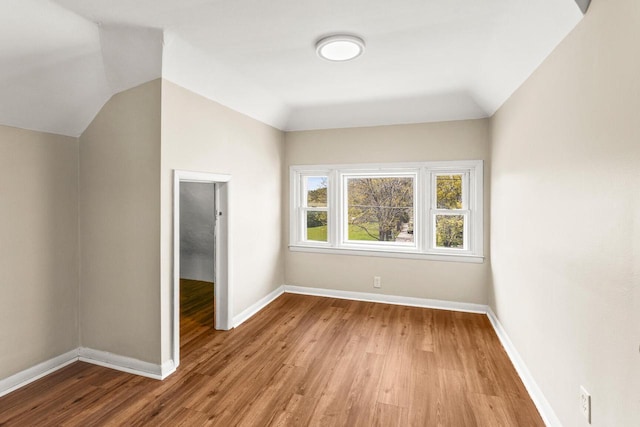 4648 S Kansas Ave Unit 4650, Saint Francis, WI 53235 - bonus room featuring light wood-type flooring, baseboards, and lofted ceiling
