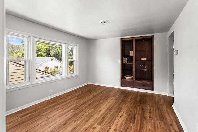 4648 S Kansas Ave Unit 4650, Saint Francis, WI 53235 - unfurnished room with wood finished floors and baseboards