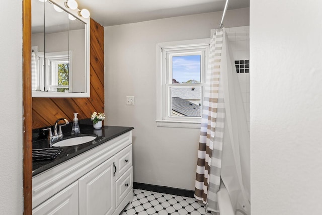 4648 S Kansas Ave Unit 4650, Saint Francis, WI 53235 - bathroom with vanity and a shower with shower curtain