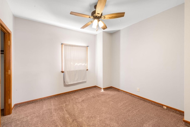 1925 Salisbury Rd, West Bend, WI 53090 - unfurnished bedroom with carpet floors, baseboards, and ceiling fan