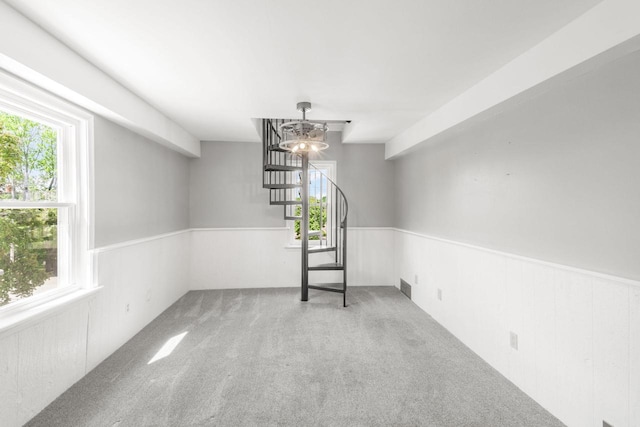1925 Salisbury Rd, West Bend, WI 53090 - empty room with carpet floors, wainscoting, and stairs