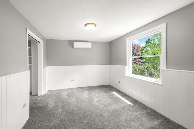 1925 Salisbury Rd, West Bend, WI 53090 - carpeted empty room with a wainscoted wall and an AC wall unit