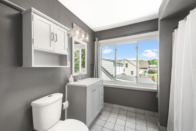 1925 Salisbury Rd, West Bend, WI 53090 - full bath featuring vanity, toilet, and tile patterned floors