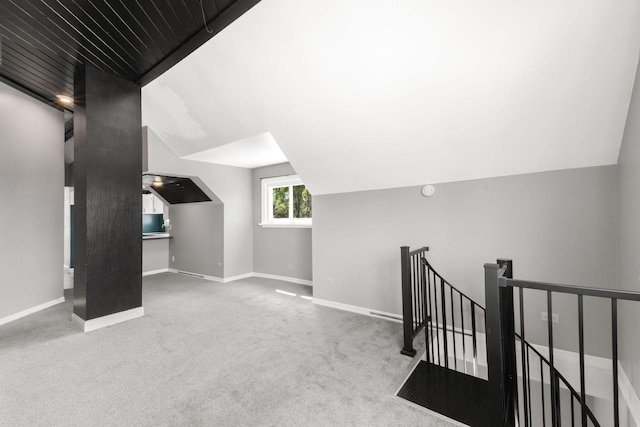 1925 Salisbury Rd, West Bend, WI 53090 - additional living space featuring vaulted ceiling, baseboards, and carpet flooring