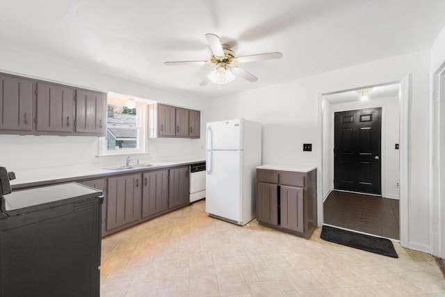 1925 Salisbury Rd, West Bend, WI 53090 - kitchen featuring white appliances, a sink, ceiling fan, and light countertops