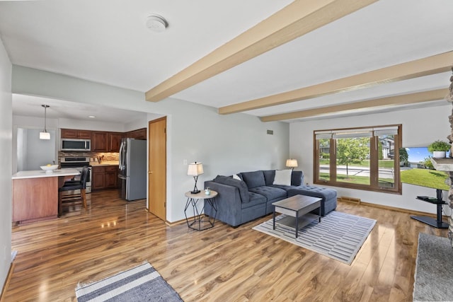 N101W16063 Santa Fe Dr, Germantown, WI 53022 - living room with light wood finished floors, beam ceiling, and baseboards