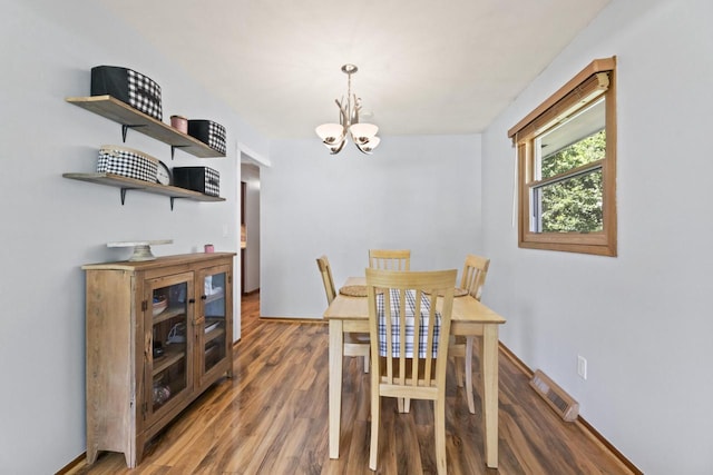 N101W16063 Santa Fe Dr, Germantown, WI 53022 - dining area featuring wood finished floors, a chandelier, and baseboards
