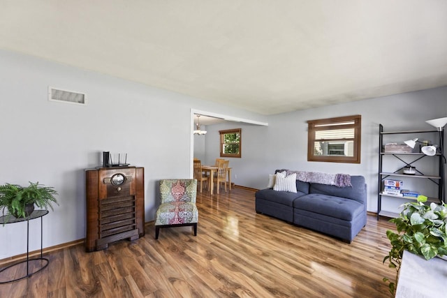 N101W16063 Santa Fe Dr, Germantown, WI 53022 - living room with wood finished floors, a chandelier, and baseboards
