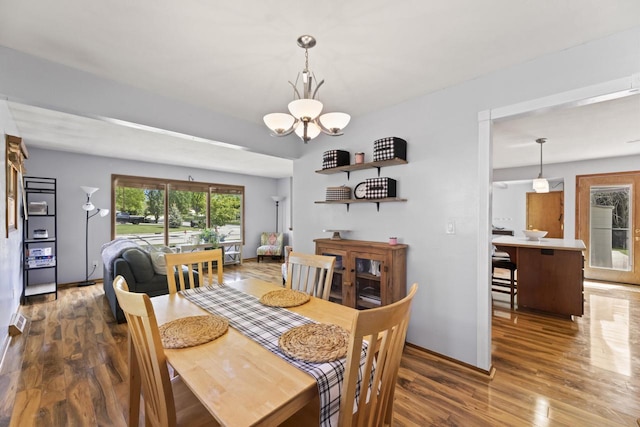 N101W16063 Santa Fe Dr, Germantown, WI 53022 - dining room featuring wood finished floors and a chandelier