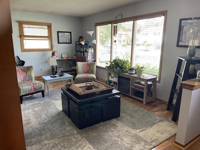 N101W16063 Santa Fe Dr, Germantown, WI 53022 - living room featuring wood finished floors, a desk, and baseboards
