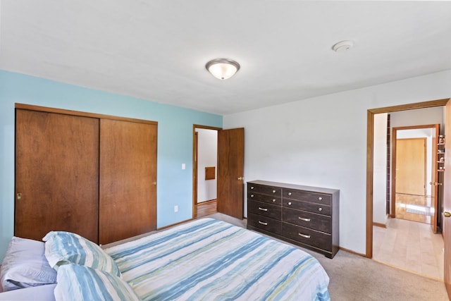 N101W16063 Santa Fe Dr, Germantown, WI 53022 - bedroom with a closet, light carpet, and baseboards