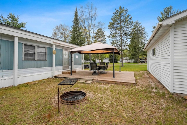 N9578 Dahleen Ln, Crivitz, WI 54114 - view of grassy yard featuring a gazebo, a wooden deck, and a fire pit