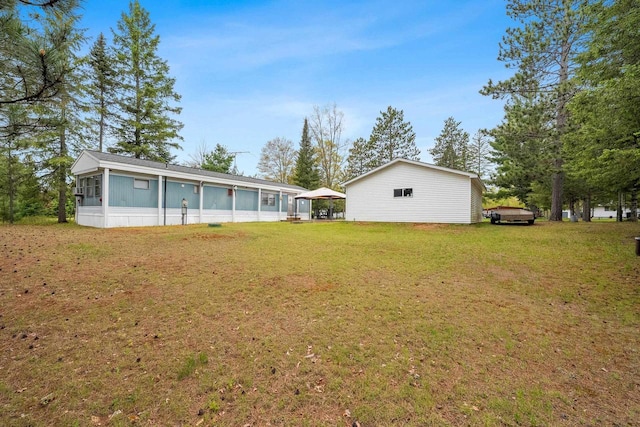N9578 Dahleen Ln, Crivitz, WI 54114 - back of house with a lawn and a sunroom