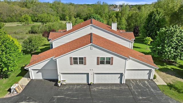 660 Wood River Ct Unit 1, West Bend, WI 53095 - view of subject property with a heavily wooded area