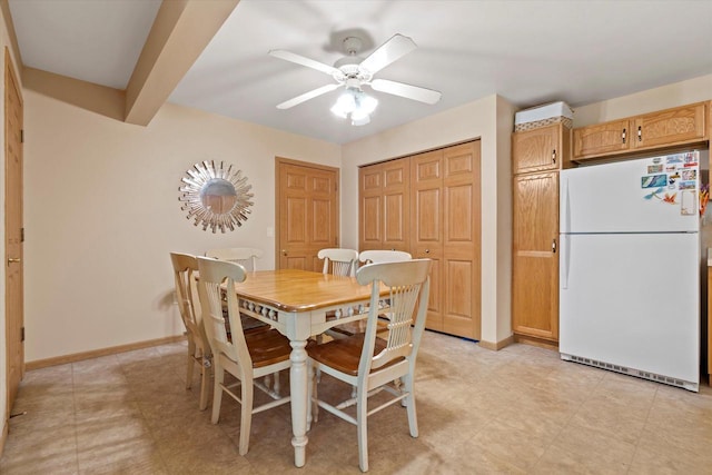 660 Wood River Ct Unit 1, West Bend, WI 53095 - dining space with a ceiling fan and baseboards