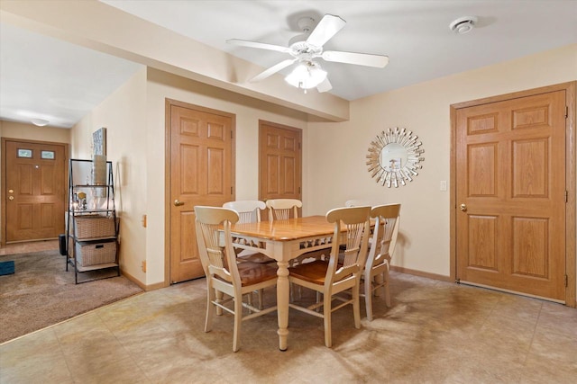 660 Wood River Ct Unit 1, West Bend, WI 53095 - dining room with a ceiling fan and baseboards