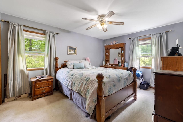 3324 County Highway Cc, Slinger, WI 53086 - bedroom with multiple windows, light carpet, and ceiling fan