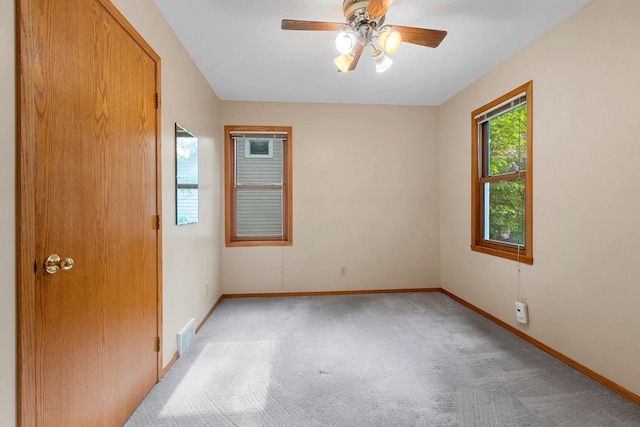 203 E 1st St, Kimberly, WI 54136 - unfurnished room featuring light carpet, baseboards, and a ceiling fan