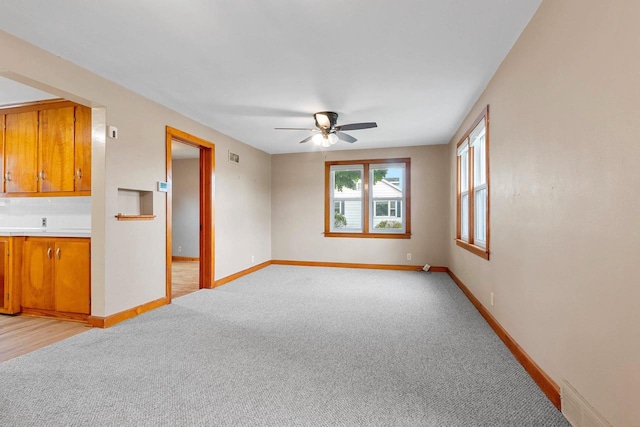 203 E 1st St, Kimberly, WI 54136 - empty room featuring ceiling fan, light carpet, and baseboards