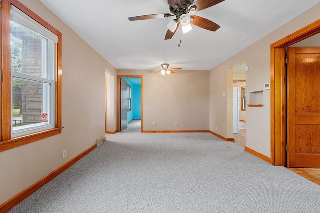 203 E 1st St, Kimberly, WI 54136 - spare room featuring a ceiling fan, light carpet, and baseboards