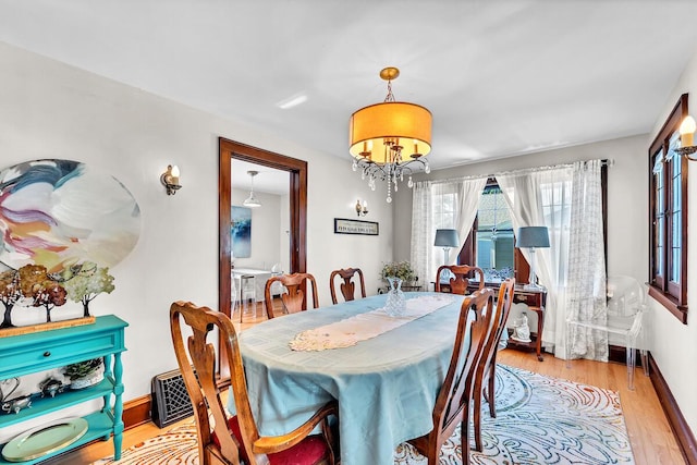 2254 N 73rd St, Wauwatosa, WI 53213 - dining area with light wood finished floors and baseboards