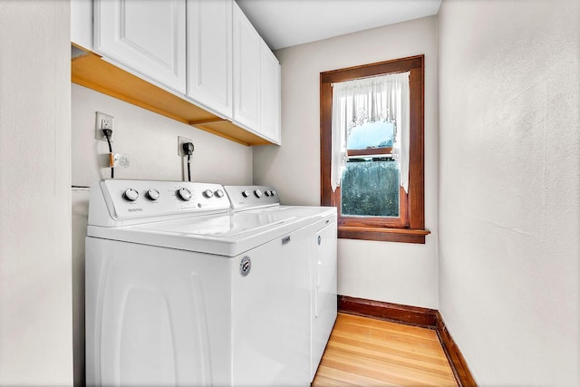 2254 N 73rd St, Wauwatosa, WI 53213 - washroom with washer and dryer, cabinet space, light wood-style flooring, and baseboards