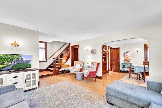2254 N 73rd St, Wauwatosa, WI 53213 - living room with arched walkways, wood finished floors, and stairway