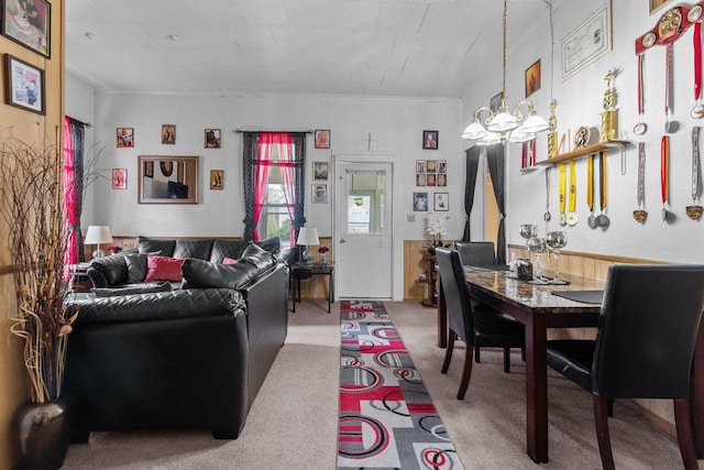 805 N State St, Appleton, WI 54911 - carpeted living room featuring a chandelier, wainscoting, and ornamental molding